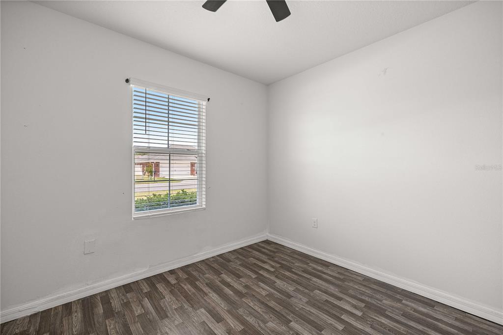 3902 Southeast 99th Street Belleview, FL 34420 - Photo 27 of 28 an empty room with a window