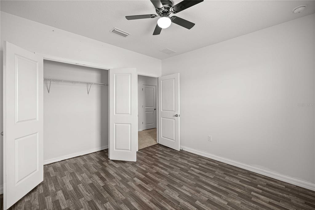 3902 Southeast 99th Street Belleview, FL 34420 - Photo 28 of 28 a view of an empty room with wooden floor