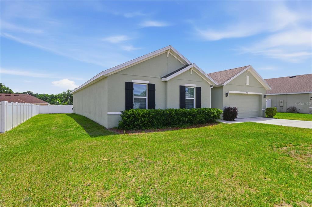 3902 Southeast 99th Street Belleview, FL 34420 - Photo 3 of 28 a view of a yard in front of a house with a yard
