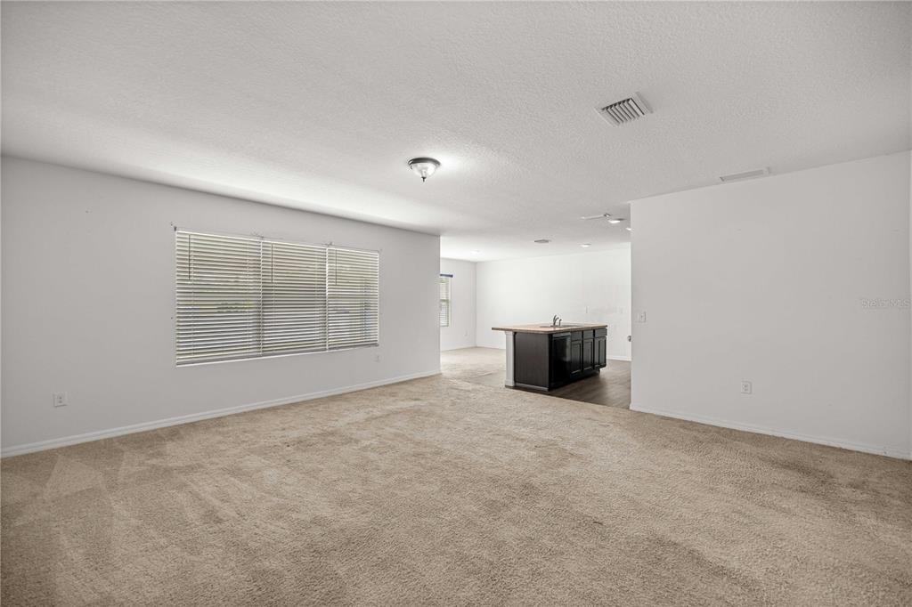 3902 Southeast 99th Street Belleview, FL 34420 - Photo 8 of 28 an empty room with windows