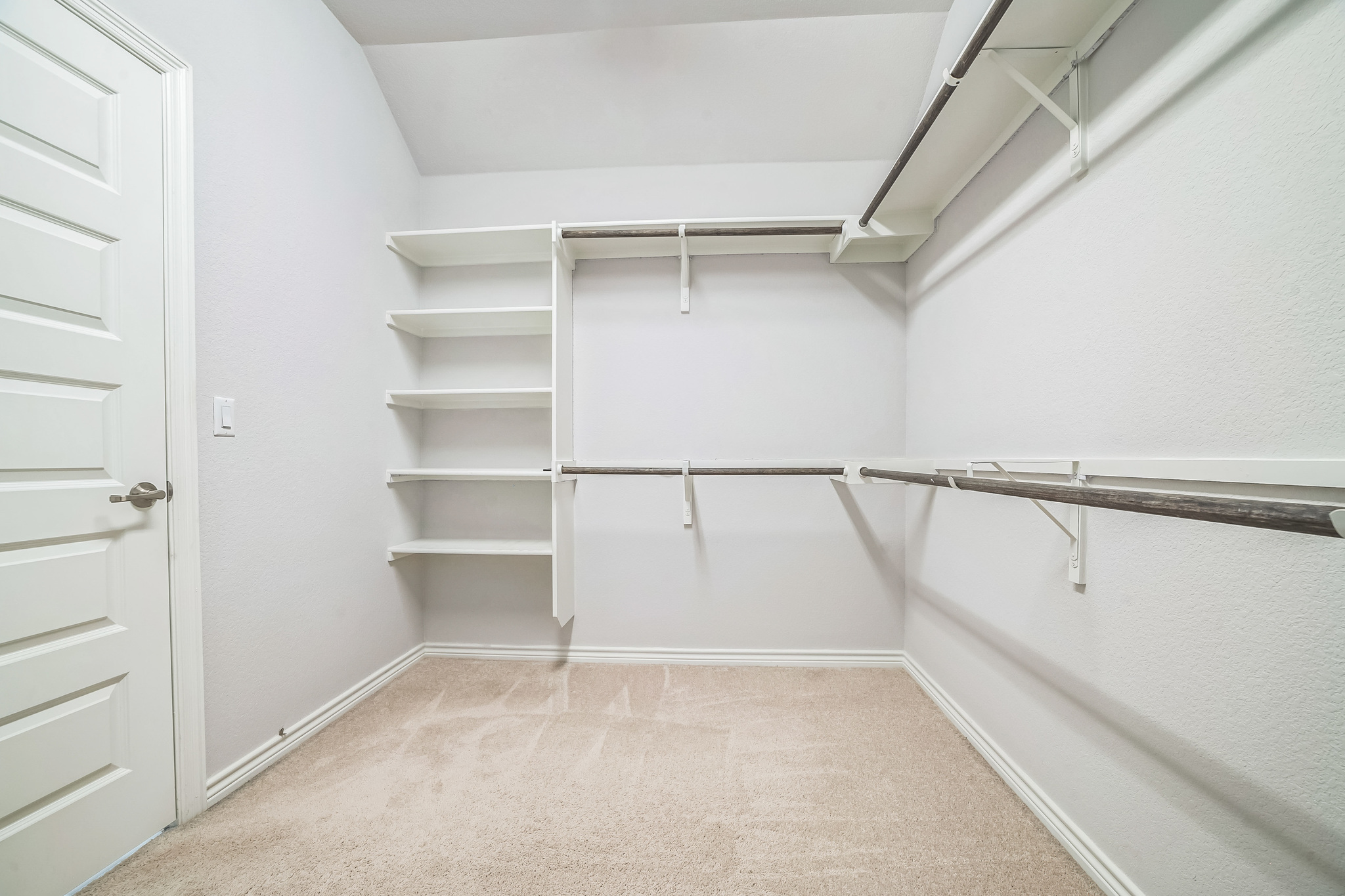 14300 McCoy Loop, Unit 21 Austin, TX 78717 - Photo 18 of 40 Walk-in closet featuring carpeted floors, built-in shelving, and hanging rods