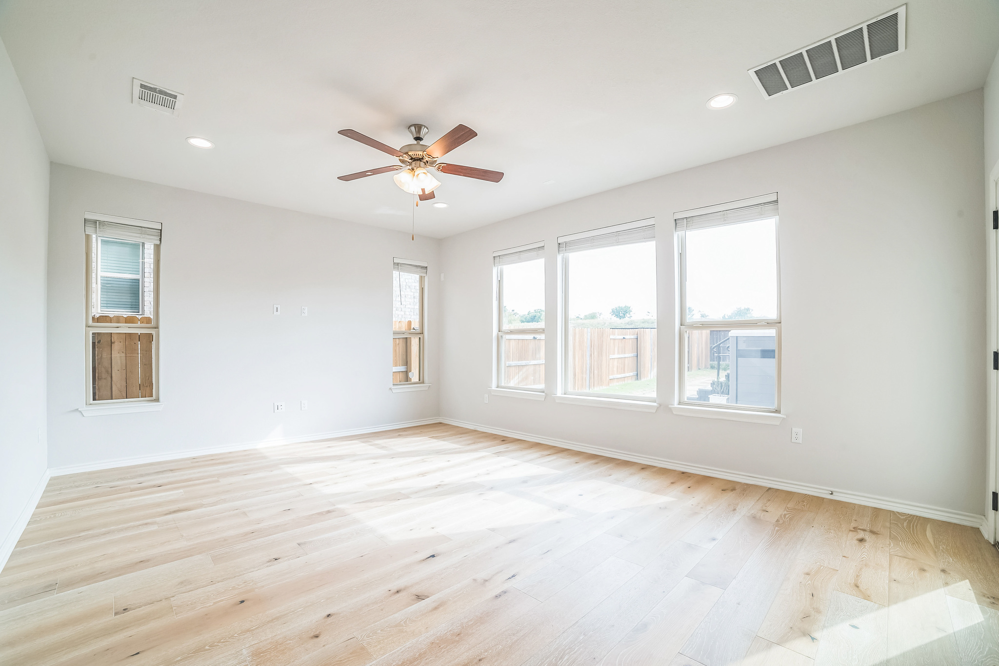 14300 McCoy Loop, Unit 21 Austin, TX 78717 - Photo 26 of 40 Spacious room featuring light-colored flooring, white walls, recessed lighting, and a ceiling fan