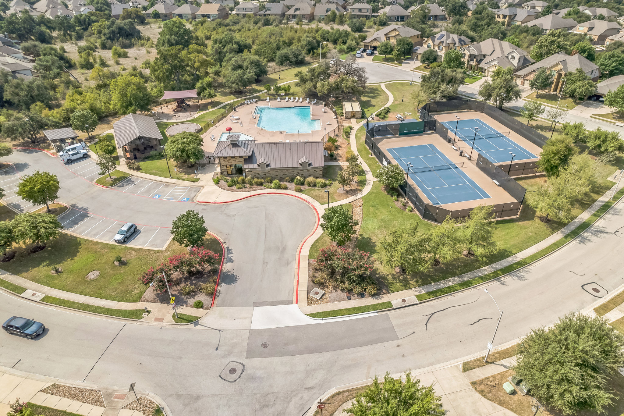 14300 McCoy Loop, Unit 21 Austin, TX 78717 - Photo 35 of 40 Enjoy access to a swimming pool, two tennis courts, and a clubhouse within the community