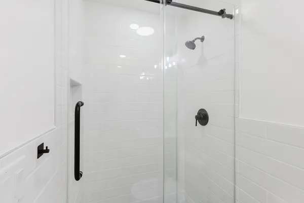 a bathroom with a shower and a toilet