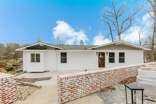 a view of a living room filled with furniture
