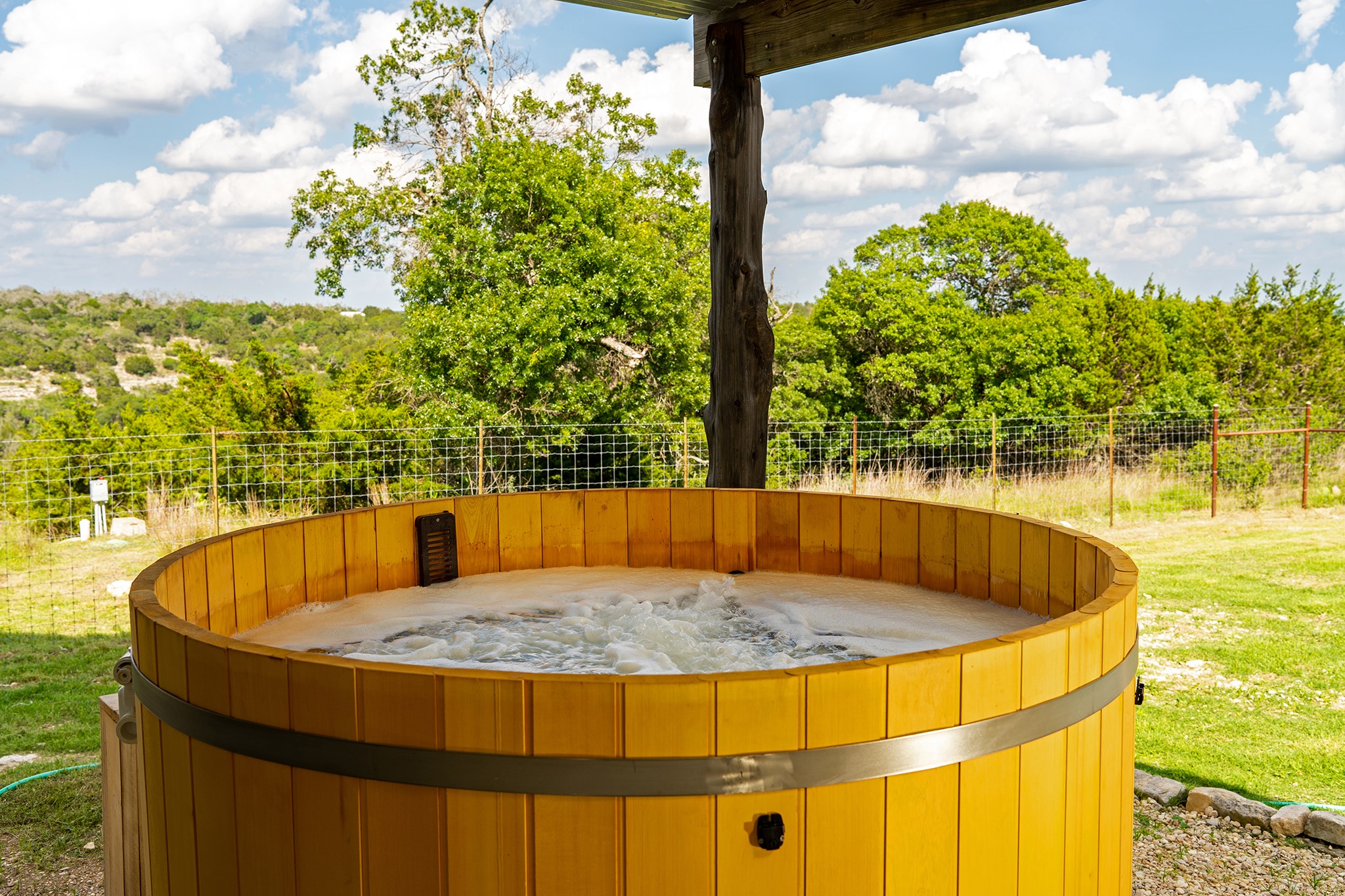 117 Point Road Fredericksburg, TX 78624 - Photo 15 of 40 Step out of your primary suite to evening unwinding in the Japanese soaking tub.