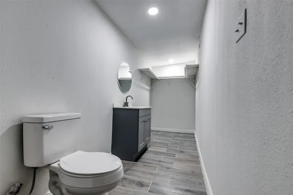 a bathroom with a toilet and a sink
