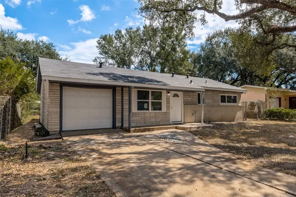 a front view of a house with a garage