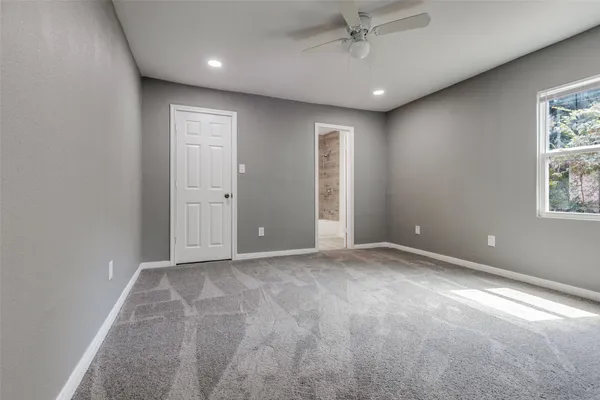 a view of an empty room with a window