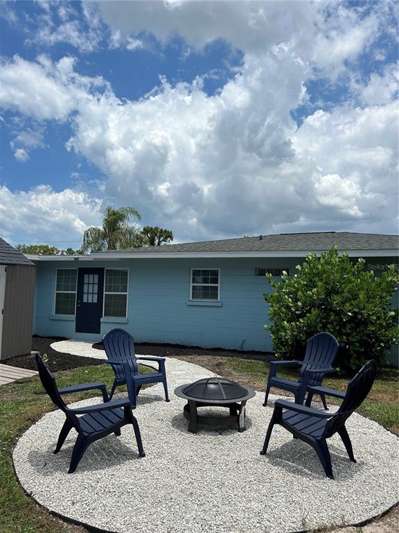 688 Constance Road Venice, FL 34293 - Photo 11 of 11 a backyard of a house with outdoor seating