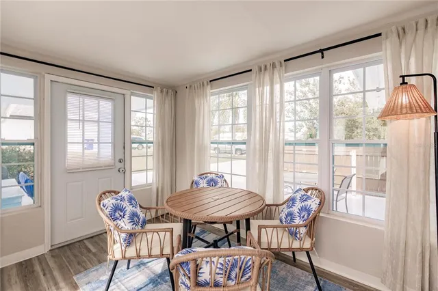 a view of a room with lounge chair wooden floor