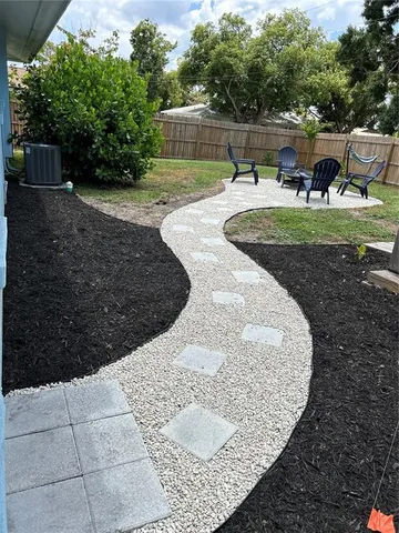 a view of a chairs and table in the patio