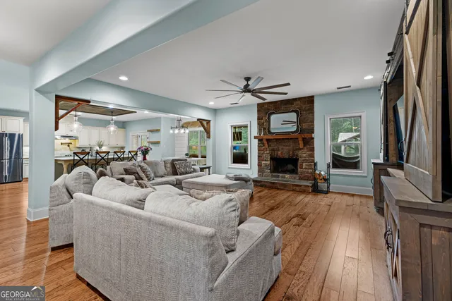 a living room with fireplace furniture and a flat screen tv