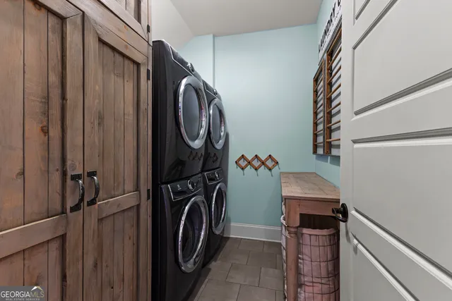 a hallway with couches and a fireplace