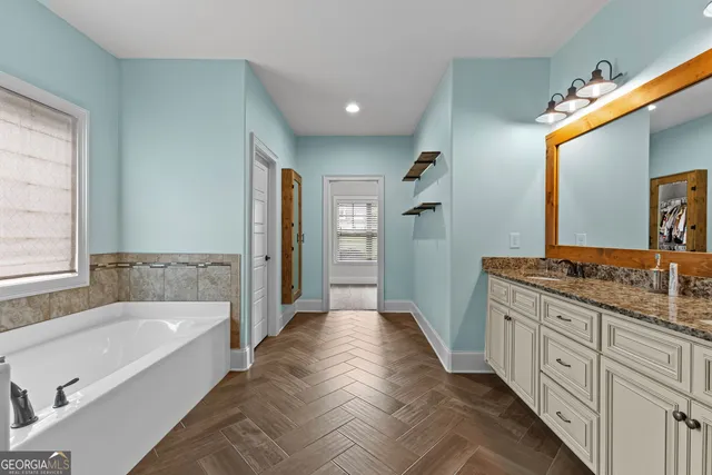 a bathroom with a glass shower door