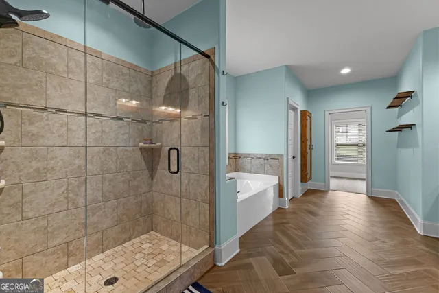 a view of walk in closet with clothes