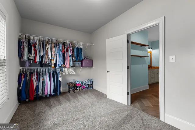 a bathroom with a bathtub a double vanity sink and mirror