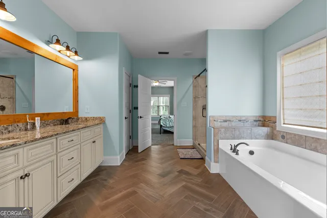 a bathroom with a bathtub and a shower