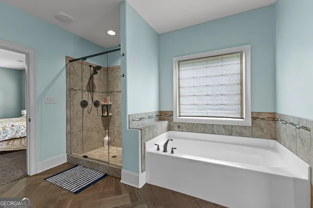 a view of entryway and hall with wooden floor