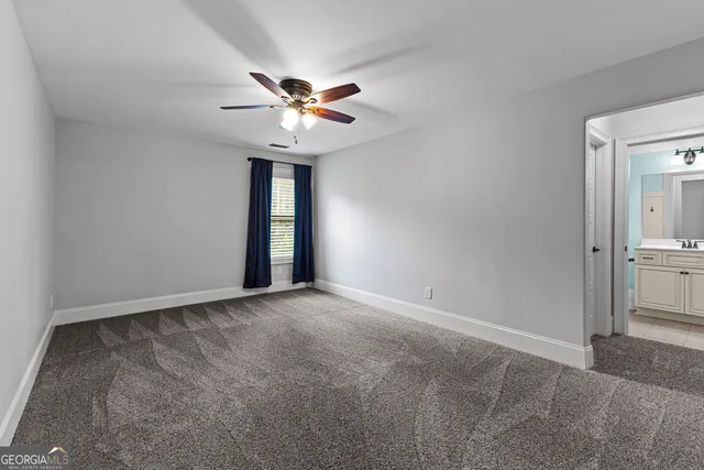 a room with a bed and a chandelier