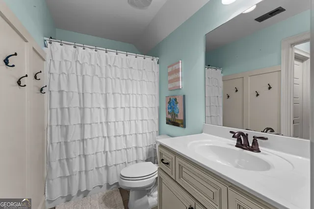 a view of a porch with furniture and garden