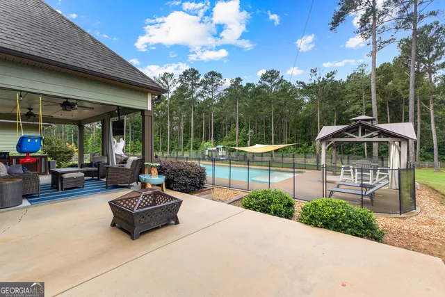 a front view of a house with a garden and plants