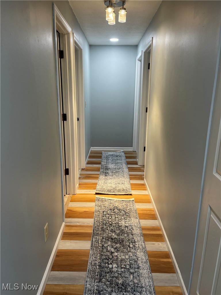 34 Hawk Ridge Rittman, OH 44270 - Photo 11 of 13 Hall with light hardwood / wood-style floors