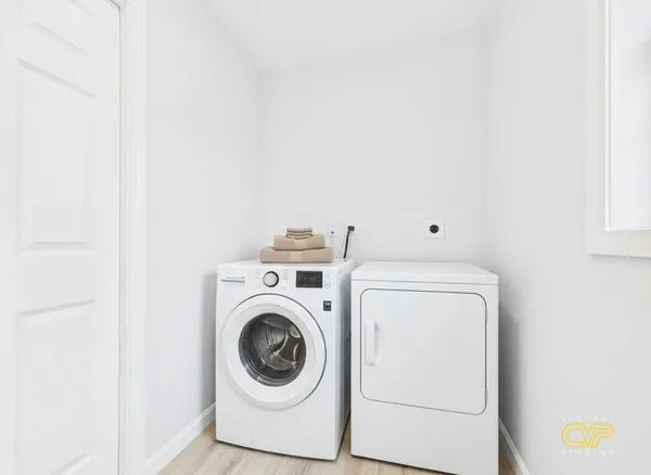 a utility room with dryer and washer