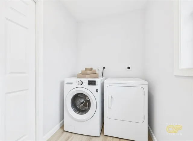 a utility room with dryer and washer