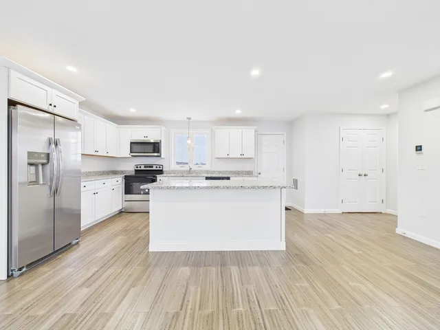a view of kitchen with wooden floor