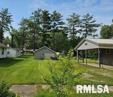 a house with green field in front of it