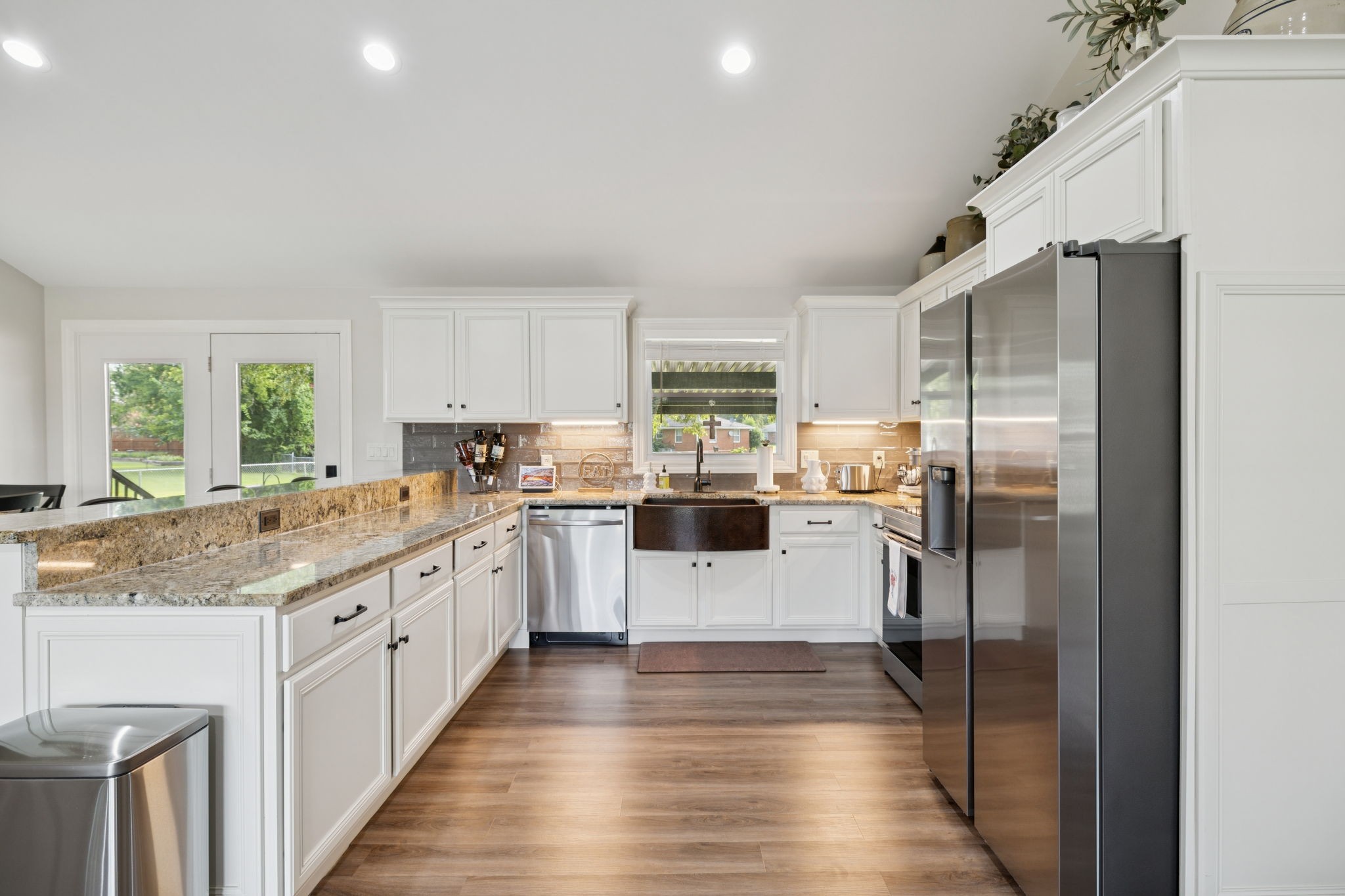 213 Knob Road Lebanon, TN 37087 - Photo 11 of 39 a kitchen with stainless steel appliances granite countertop a refrigerator sink and cabinets