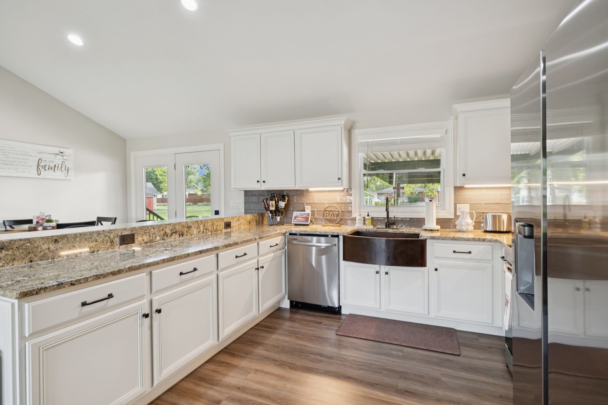 213 Knob Road Lebanon, TN 37087 - Photo 12 of 39 a kitchen with granite countertop white cabinets and white appliances