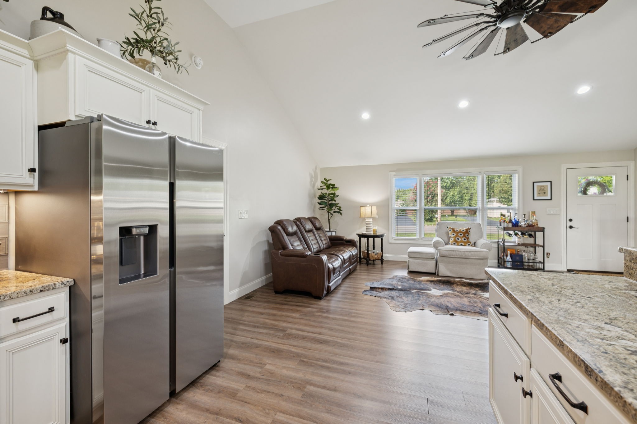 213 Knob Road Lebanon, TN 37087 - Photo 14 of 39 a living room with furniture wooden floor and a chandelier