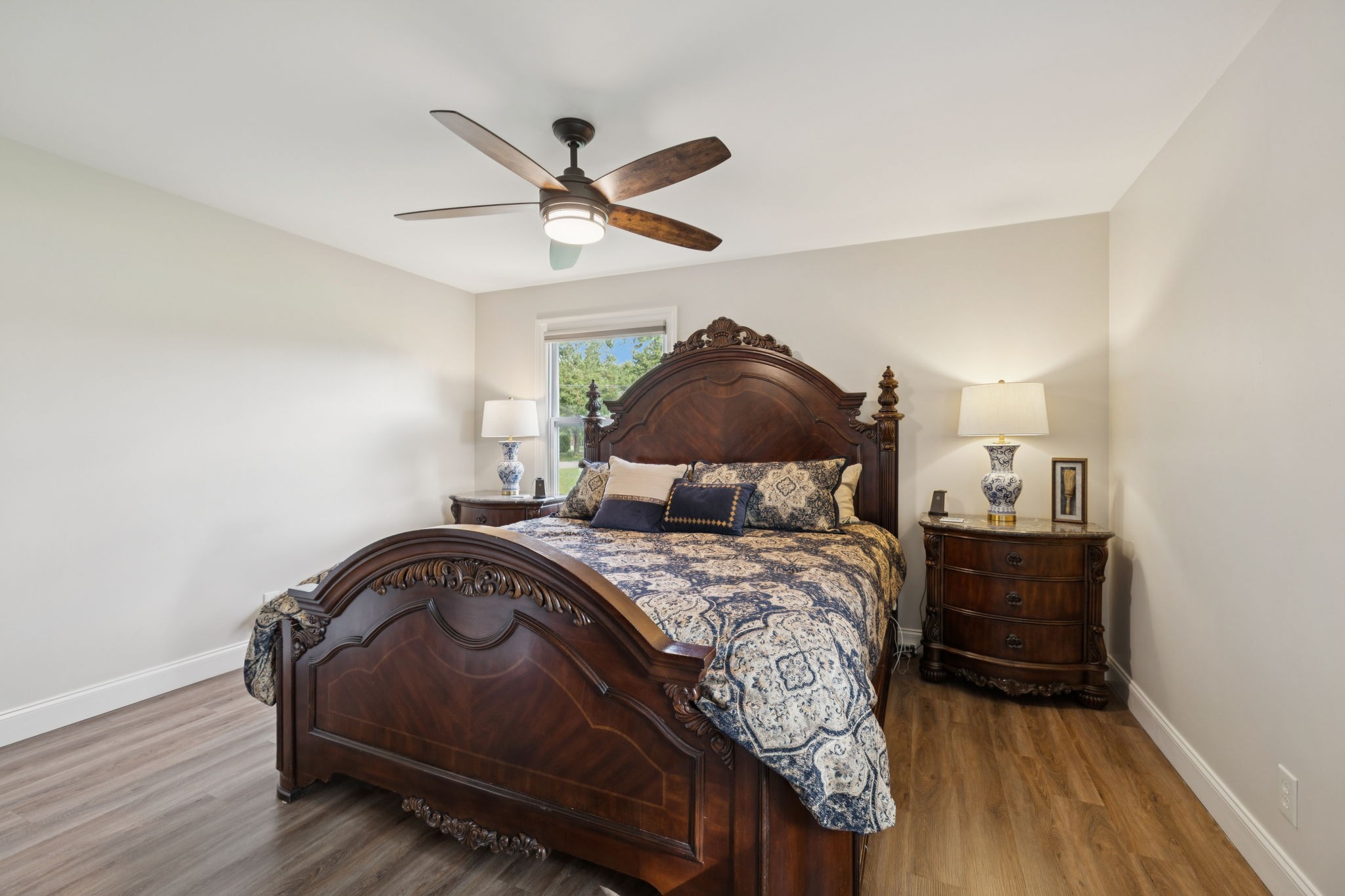 213 Knob Road Lebanon, TN 37087 - Photo 20 of 39 a bedroom with a bed and wooden floor