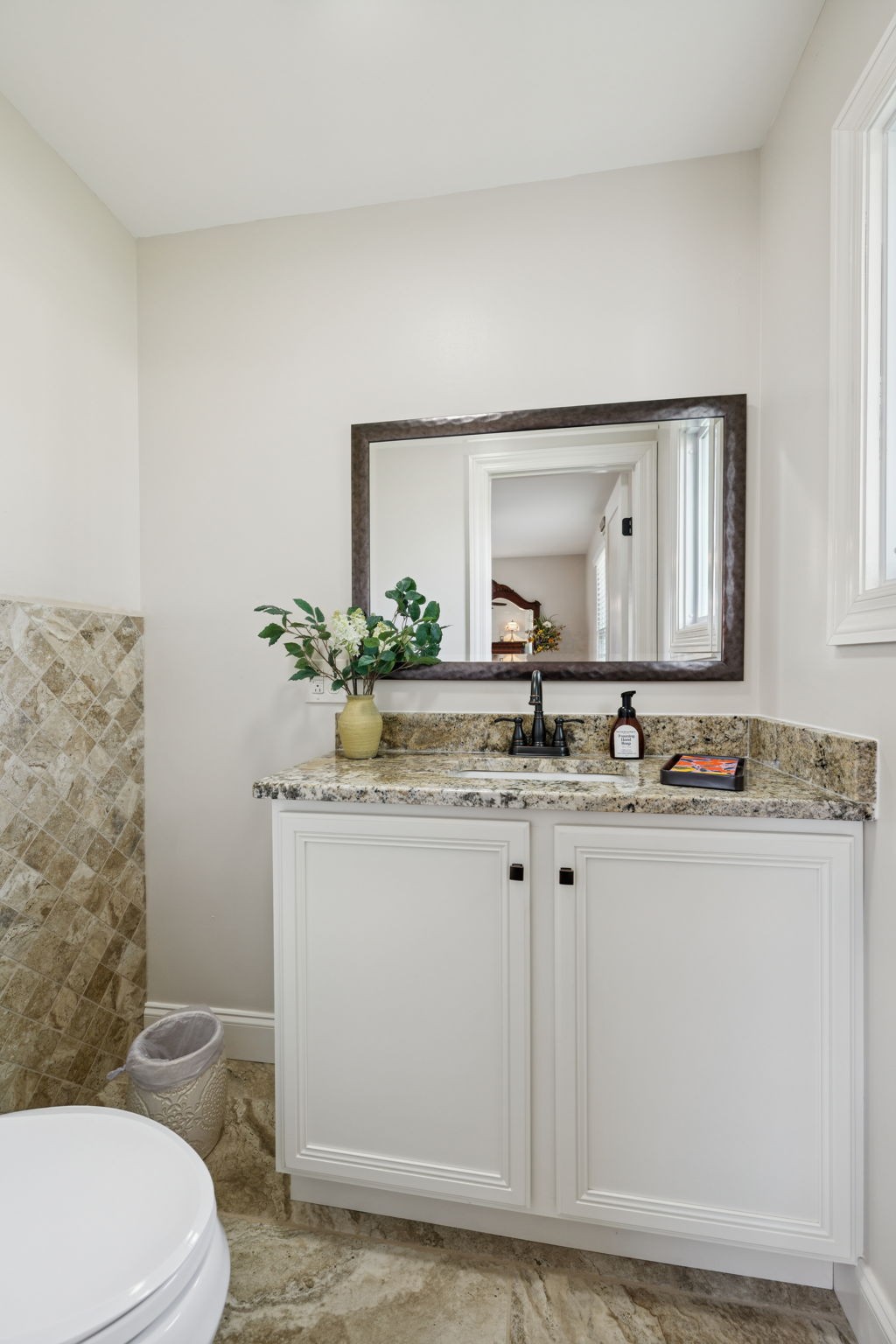 213 Knob Road Lebanon, TN 37087 - Photo 27 of 39 a bathroom with a granite countertop sink a toilet and mirror