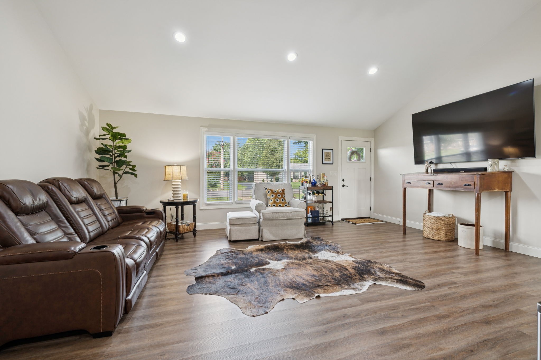 213 Knob Road Lebanon, TN 37087 - Photo 9 of 39 a living room with furniture and a flat screen tv