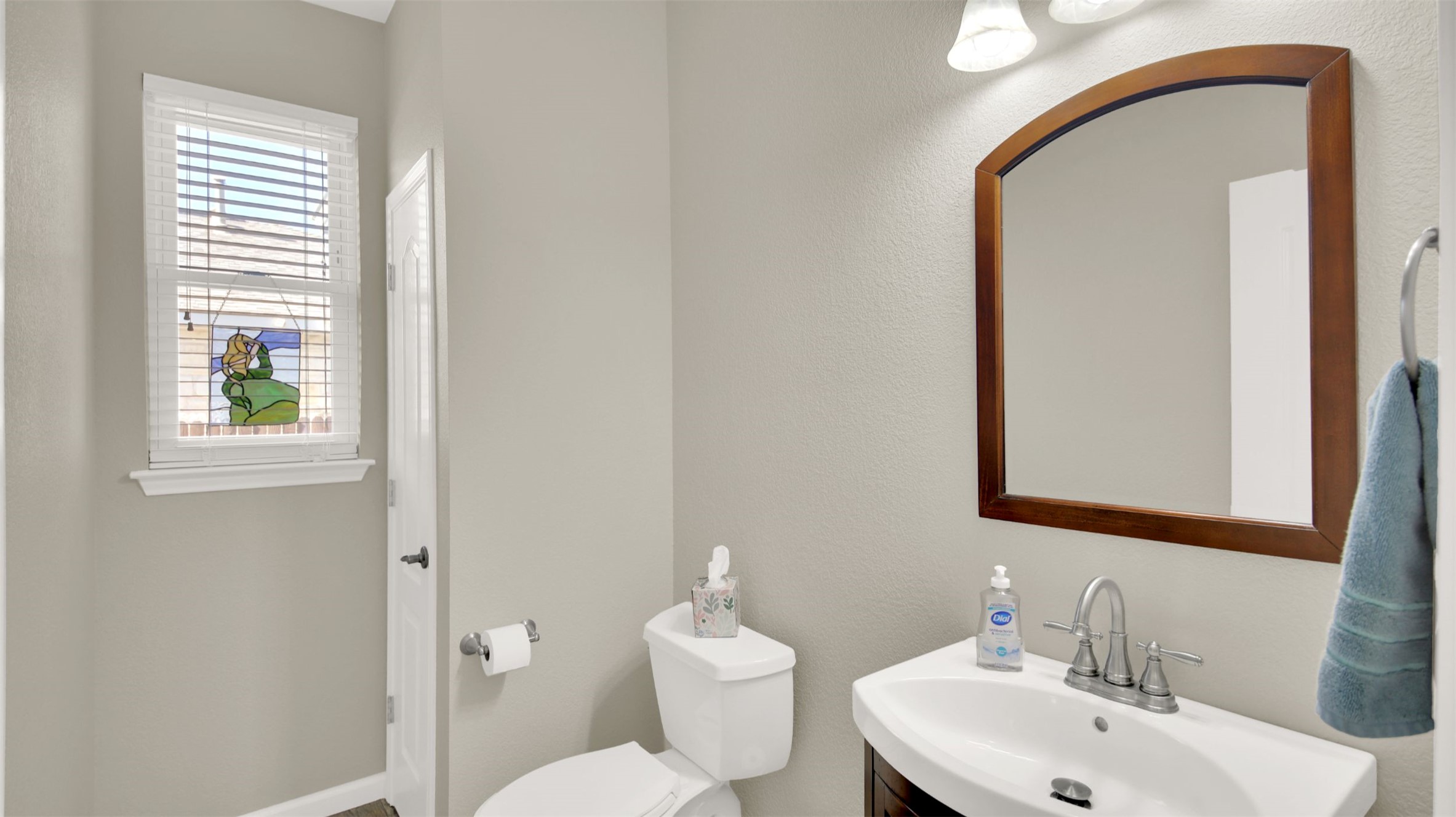 1210 Mathias Street Cedar Park, TX 78613 - Photo 15 of 31 Half bathroom downstairs featuring vanity and a textured wall