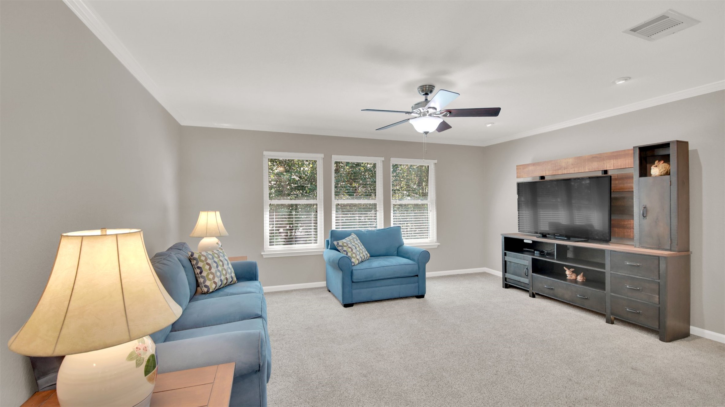 1210 Mathias Street Cedar Park, TX 78613 - Photo 16 of 31 Large second living area upstairs with ornamental molding, light carpet, and ceiling fan