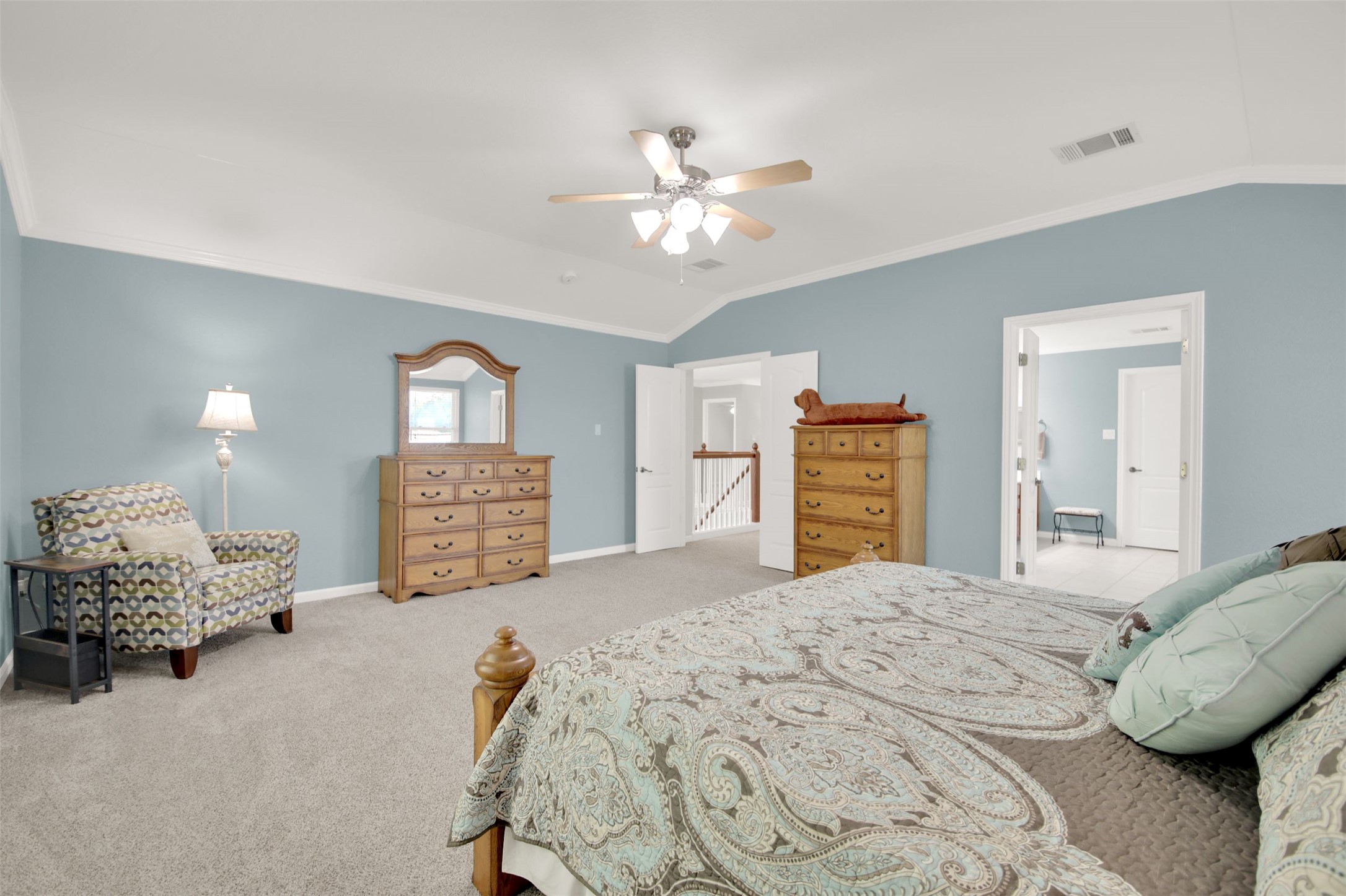 1210 Mathias Street Cedar Park, TX 78613 - Photo 21 of 31 Bedroom featuring ornamental molding, lofted ceiling, light colored carpet, and a ceiling fan