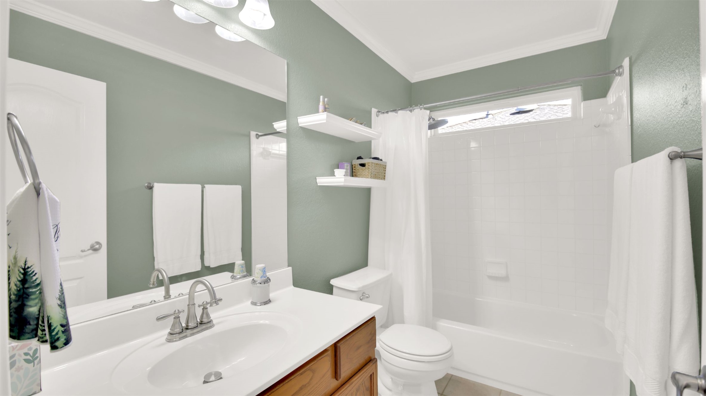 1210 Mathias Street Cedar Park, TX 78613 - Photo 26 of 31 Bathroom with shower / bathtub combination with curtain, vanity, and crown molding