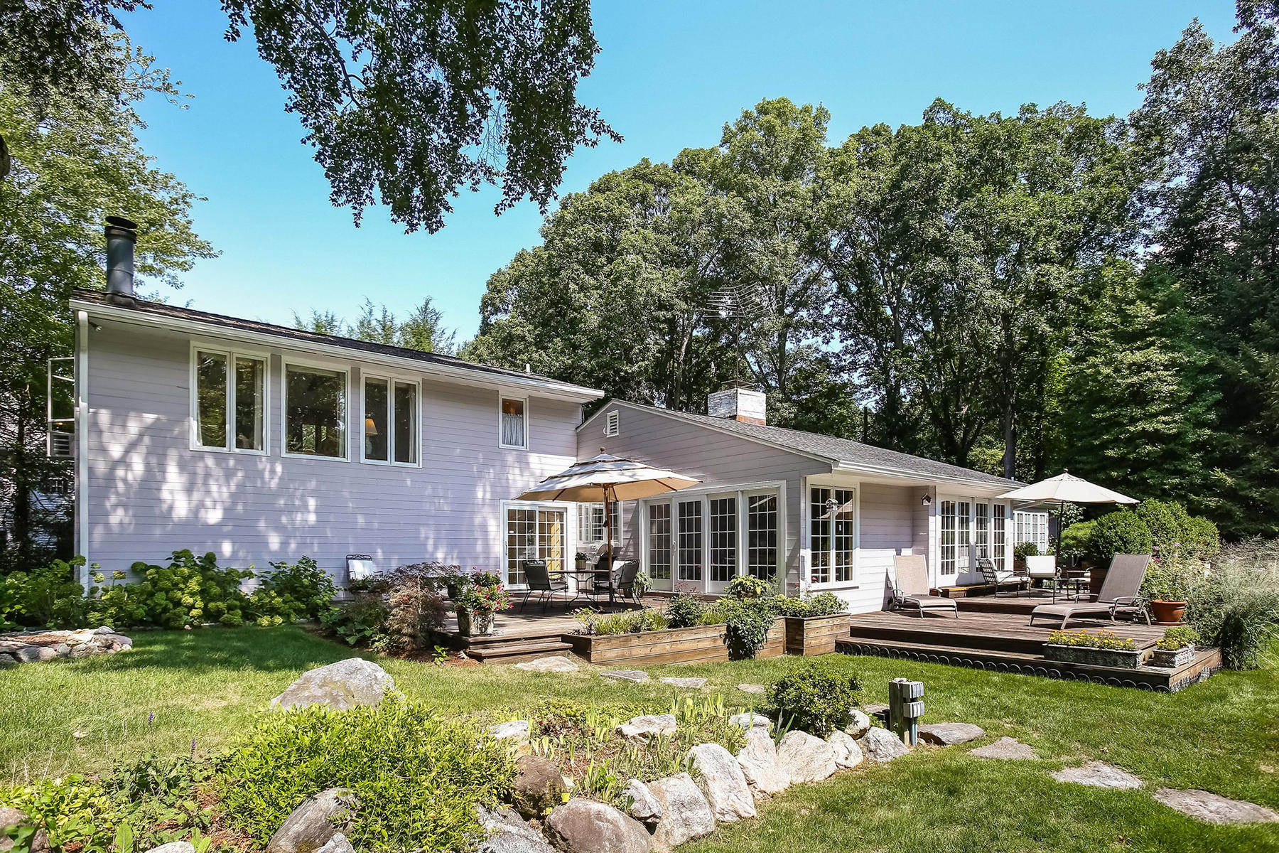30 Old Oak Road Darien, CT 06820 - Photo 19 of 25 a front view of a house with swimming pool and furniture