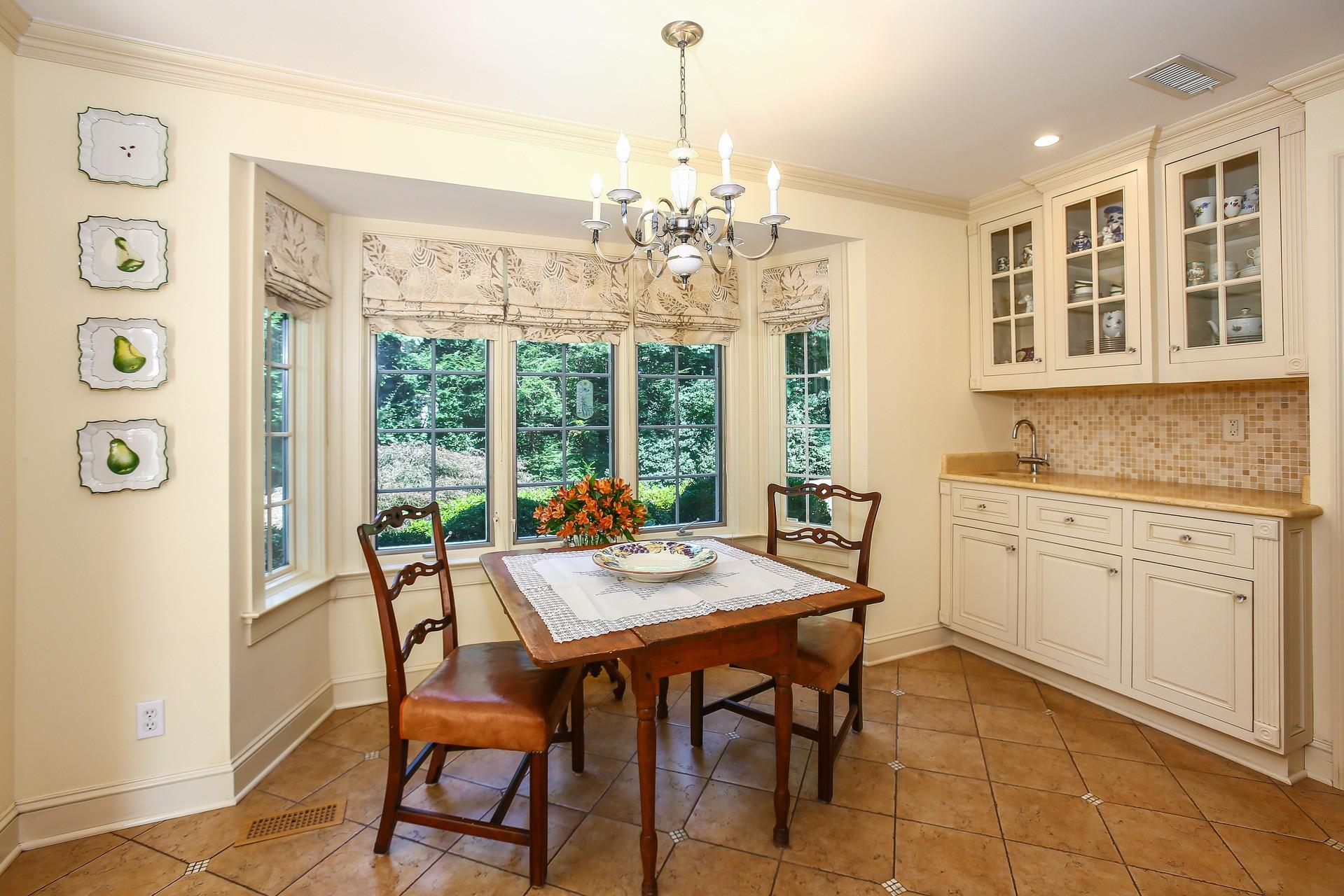 30 Old Oak Road Darien, CT 06820 - Photo 8 of 25 a view of a dining room with furniture large windows and wooden floor