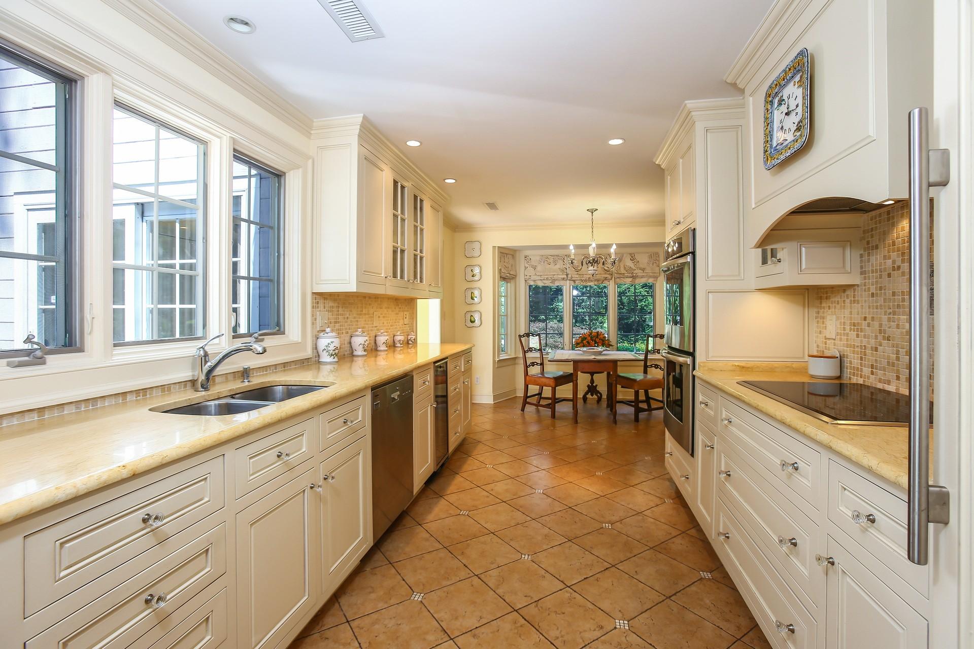 30 Old Oak Road Darien, CT 06820 - Photo 9 of 25 a large kitchen with kitchen island a large window