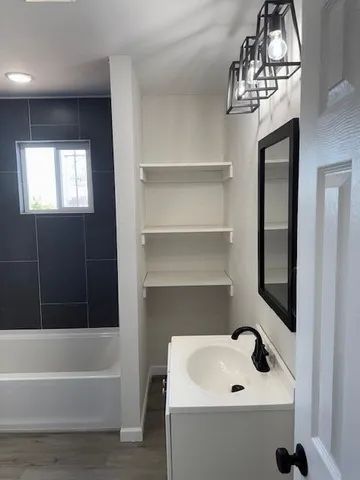 a bathroom with a sink and a bathtub