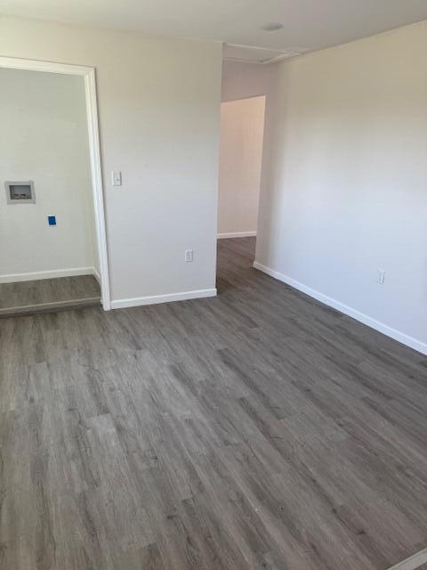 1126 East 15th Street Littlefield, TX 79339 - Photo 10 of 13 a view of an empty room with wooden floor