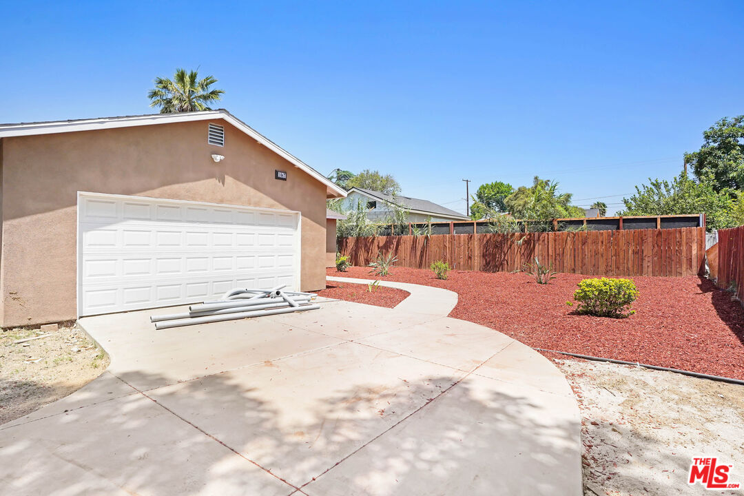 1047 West H Street Colton, CA 92324 - Photo 2 of 13 a view of a backyard with a patio