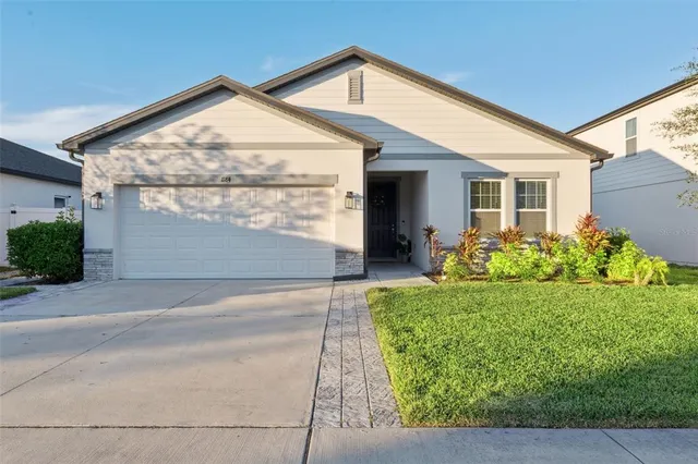 front view of a house with a yard