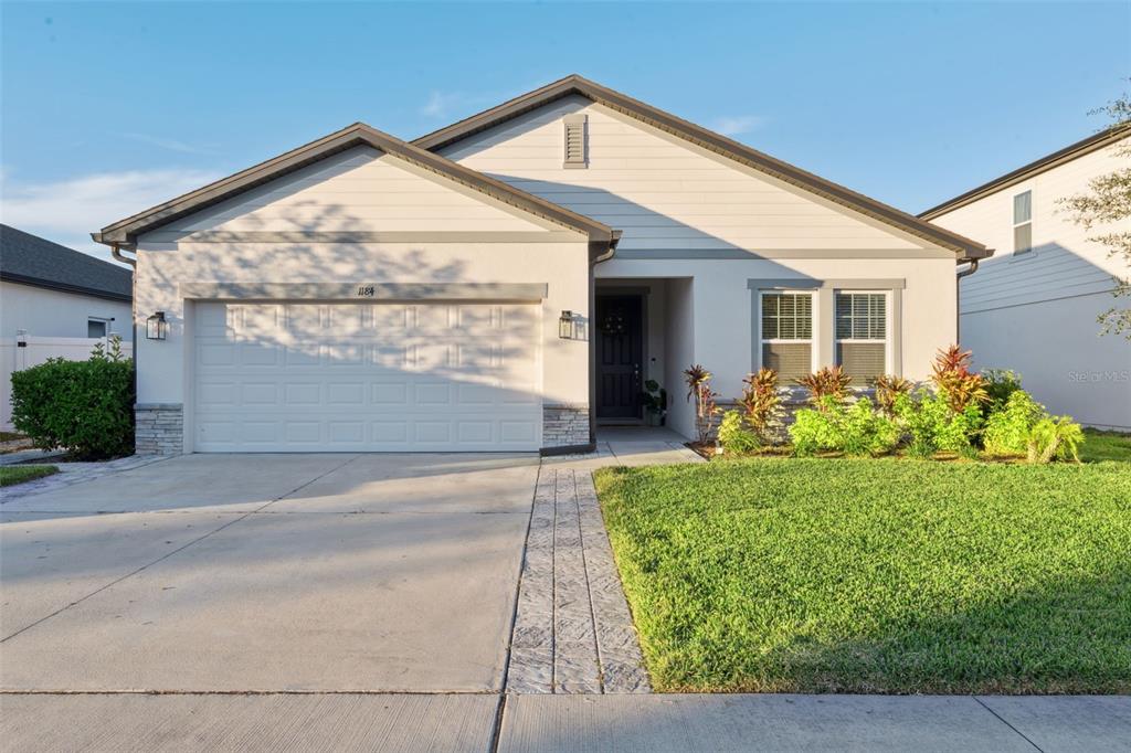 front view of a house with a yard