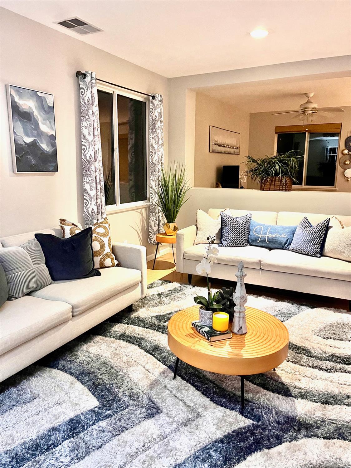 1450 Longhorn Lane Patterson, CA 95363 - Photo 16 of 32 a living room with furniture and a table